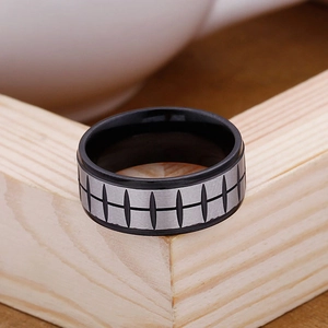 Close-up of tire tread pattern and brushed metal finish on hip hop style titanium ring