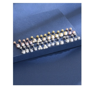 Detailed close-up of 925 silver pearl ear bone studs with secure screw back design