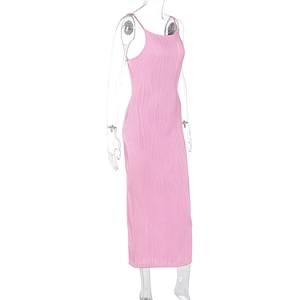 Detail of pink bodycon maxi dress featuring vertical wavy pleated texture and slim straps