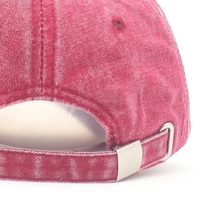 Washed red denim baseball cap featuring an adjustable metal buckle and vintage texture