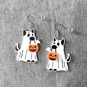 Halloween acrylic earrings featuring ghost dog with pumpkin basket on grey background
