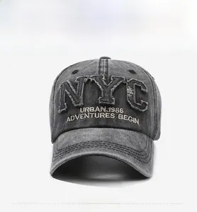 Detail of washed dark grey baseball cap featuring vintage NYC patch and urban embroidery
