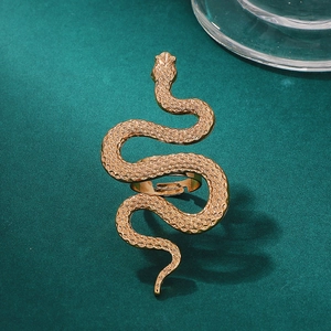 Detailed close-up of a golden snake ring featuring intricate scales and adjustable design