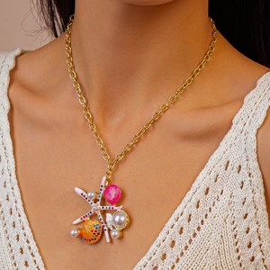 Close-up of beach vacation shell necklace with starfish, pearls and crystals for women