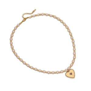 Elegant faux pearl beaded necklace with a sparkling pink heart pendant in gold finish