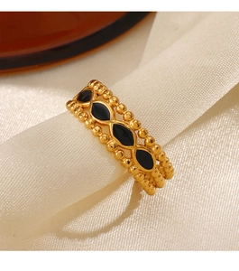 Detail of 18K gold plated ring with black rhombic enamel inlay and beaded texture edge