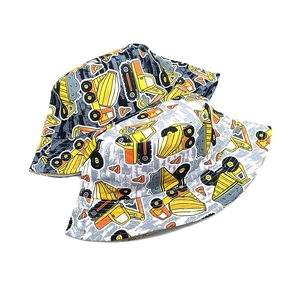Reversible kids bucket hat with construction truck print and sun protection design