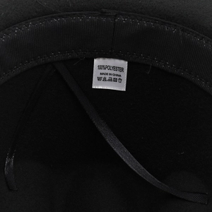 Detail view of 100% polyester fedora hat inner lining with label and black sweatband