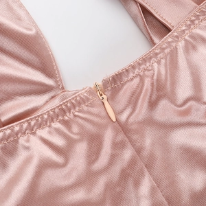 Detail of the champagne pink halter dress showing the high-quality invisible zipper