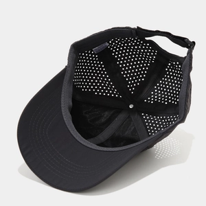 Detail view of quick-dry polyester baseball cap featuring laser-cut ventilation holes