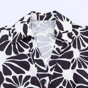Summer black and white floral print poplin dress with belt and button collar detail
