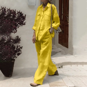 Detail of bright yellow linen-texture long sleeve shirt and wide leg trousers set