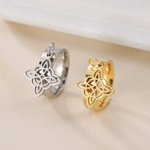 Minimalist stainless steel couple rings with hanging Celtic knot pendants in gold and silver