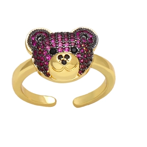 Chic golden bear ring featuring purple and black gemstone paving in a minimalist style