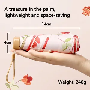 Compact cream folding umbrella with red floral pattern, 14cm length and 240g weight