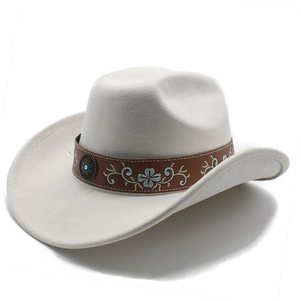 Macro detail of white felt cowboy hat with embroidered leather band and turquoise buckle