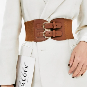 Detail of brown elastic waist belt with double gold buckles on white coat