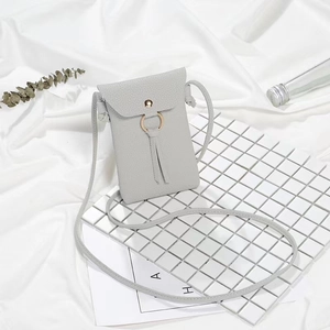 Minimalist grey lychee pattern crossbody phone bag with gold ring and tassel detail