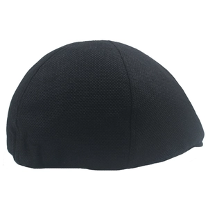 Close-up of black breathable linen cotton newsboy cap showing textured fabric weave
