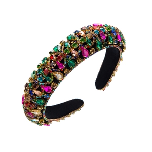 Detail of luxury baroque wide headband with colorful rhinestones on black velvet