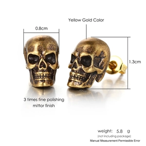 Detail view of gothic skull earrings in yellow gold finish with vintage texture dimensions