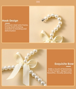 Detailed view of pearl pet clothes hanger with cream satin bow and strong metal hook