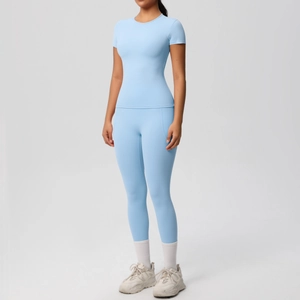Light blue two-piece yoga set featuring short sleeve tight t-shirt and high waist leggings