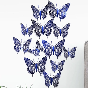 Group of twelve blue hollow-out butterfly wall stickers in varied sizes for home DIY decoration