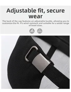 Detail of adjustable metal buckle on back of black cotton baseball cap for men