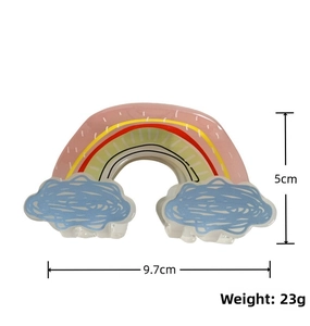 Cute rainbow acrylic hair claw clip with blue clouds and dimensions 9.7x5cm shown in detail