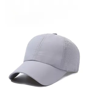 Detail view of light gray quick-dry baseball cap showing breathable laser-cut side vents