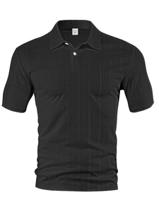 Close-up of black men's short sleeve shirt featuring textured waffle knit fabric and M tag