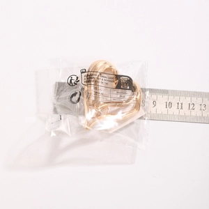 Detailed view of a gold heart-shaped ring with cross patterns measuring 5cm wide