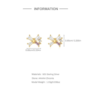 Macro detail of gold S925 sterling silver bow stud earrings with purple zircon stones