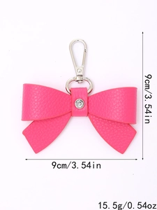 Pink leather bow keychain with rhinestones, 9cm size and 15.5g weight detail