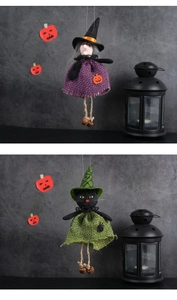 Detail of handmade Halloween witch and black cat dolls with purple and green burlap dresses