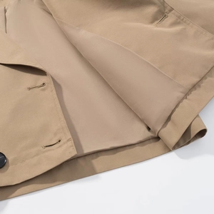 Detailed macro view of khaki trench coat interior lining, twill fabric and stitching