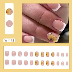 Short french sunflower press-on nails with white tips and yellow flower accents