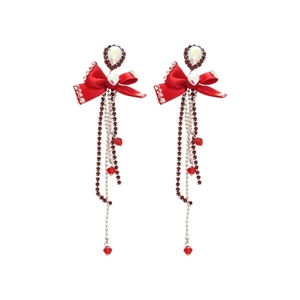 Elegant red bow earrings with sparkling rhinestone tassels for a luxurious statement look