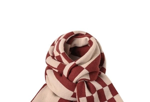 Detail of burgundy and beige checkered knit scarf showing soft texture and pattern