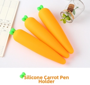 Detailed view of three creative carrot-shaped silicone pencil cases with green leaf tops
