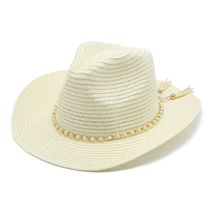 Detail of woven straw hat with pearl chain decoration and elegant hanging tassels