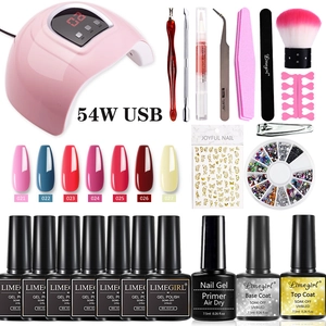 Detail view of 54W UV LED nail lamp with complete manicure tools and color gel polish set
