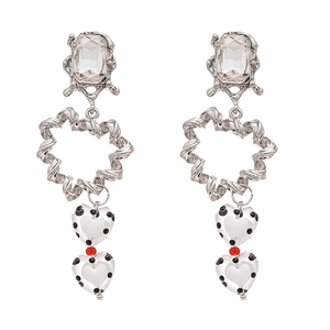 Luxe geometric earrings with crystals and black polka dot heart pendants on white background