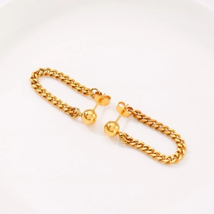 Close-up of golden stainless steel hoop earrings with chunky Cuban chain design details