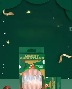 Kit unghie natalizie con punte in gel morbido e strass in una confezione festiva