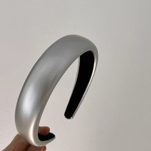 Detail of silver matte headband with soft black inner lining and smooth metallic finish