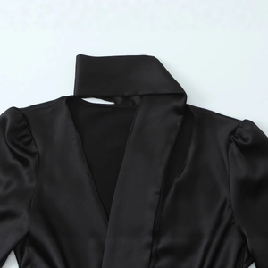 Women's black satin shirt with deep V-neckline and matching ribbon tie accessory