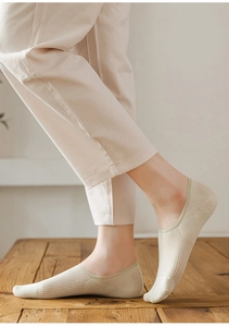Detailed close-up of beige low-cut invisible sock featuring breathable mesh side panels