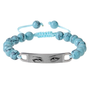 Close-up of blue beaded bracelet with custom eye pattern on silver stainless steel plate